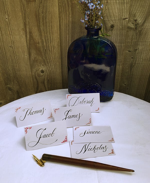 Place names written in calligraphy with pen and blue vase