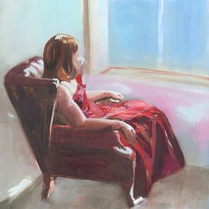 Lady in Red Dress Sitting in Red Leather Arm Chair Looking out of window